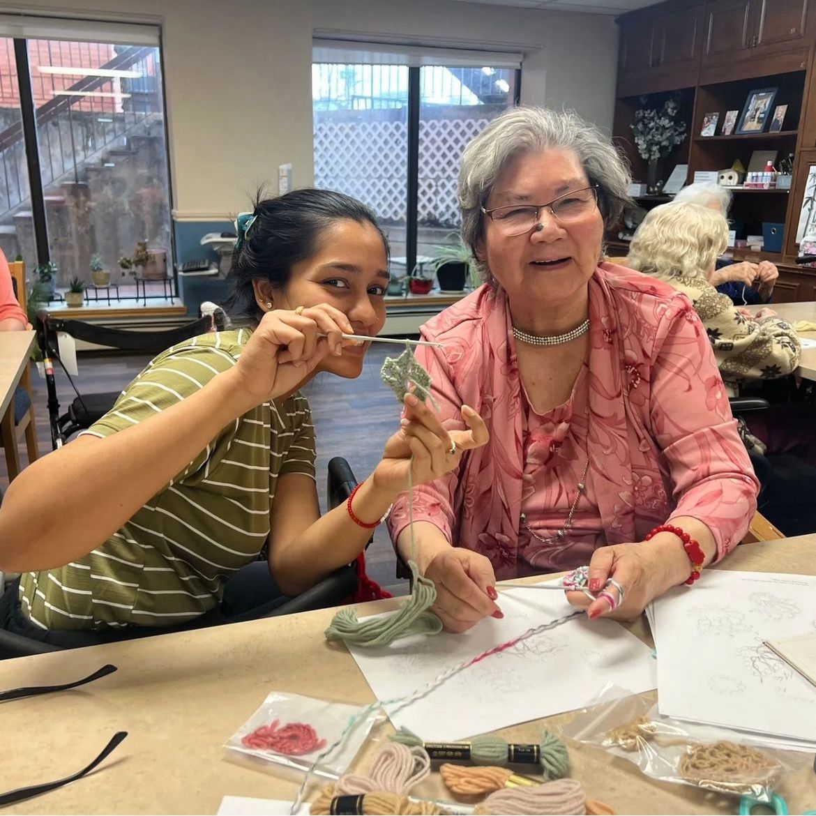 Placement student working with resident on craft program