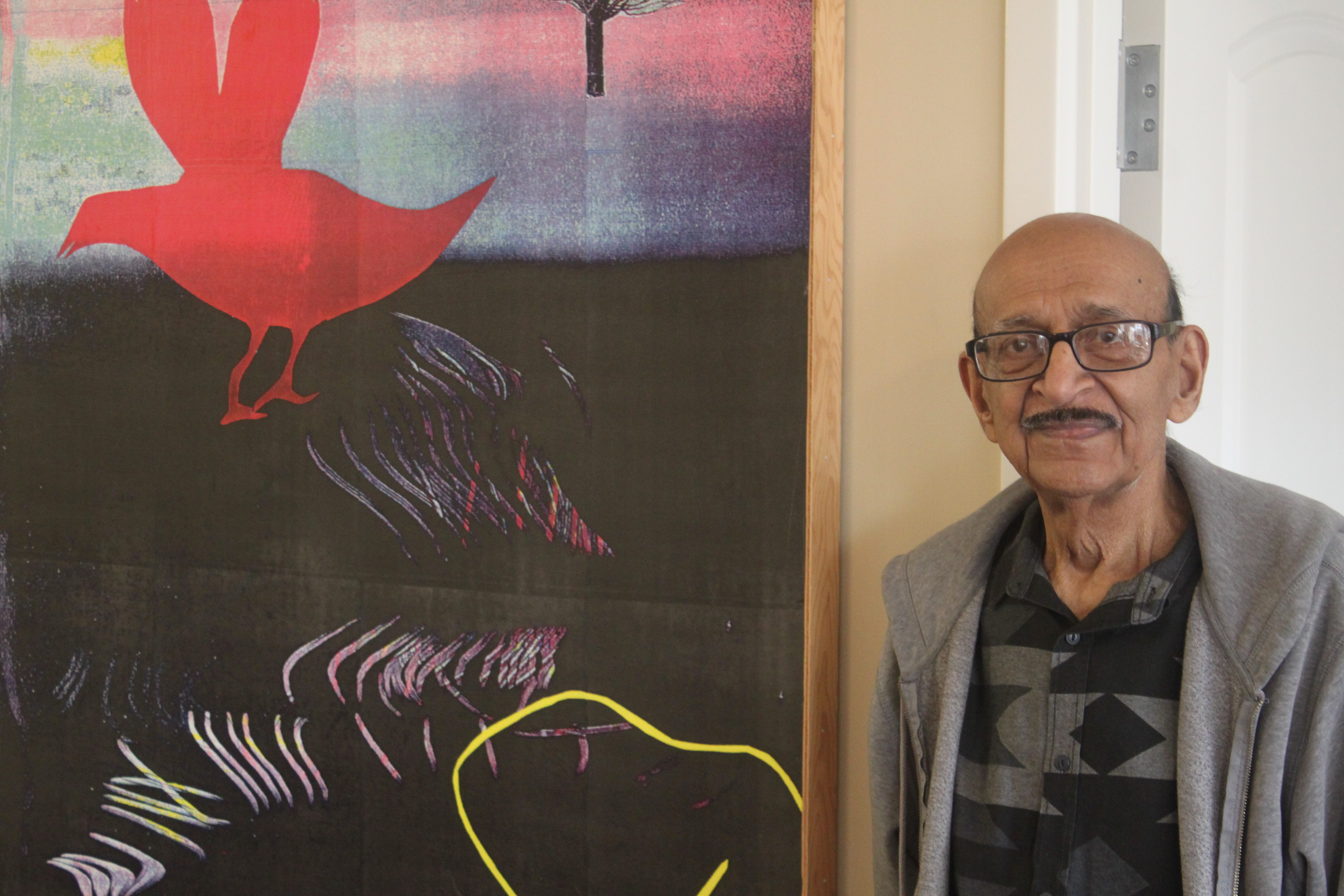 Mr. Mansaram stands beside one of his many great pieces of art. 