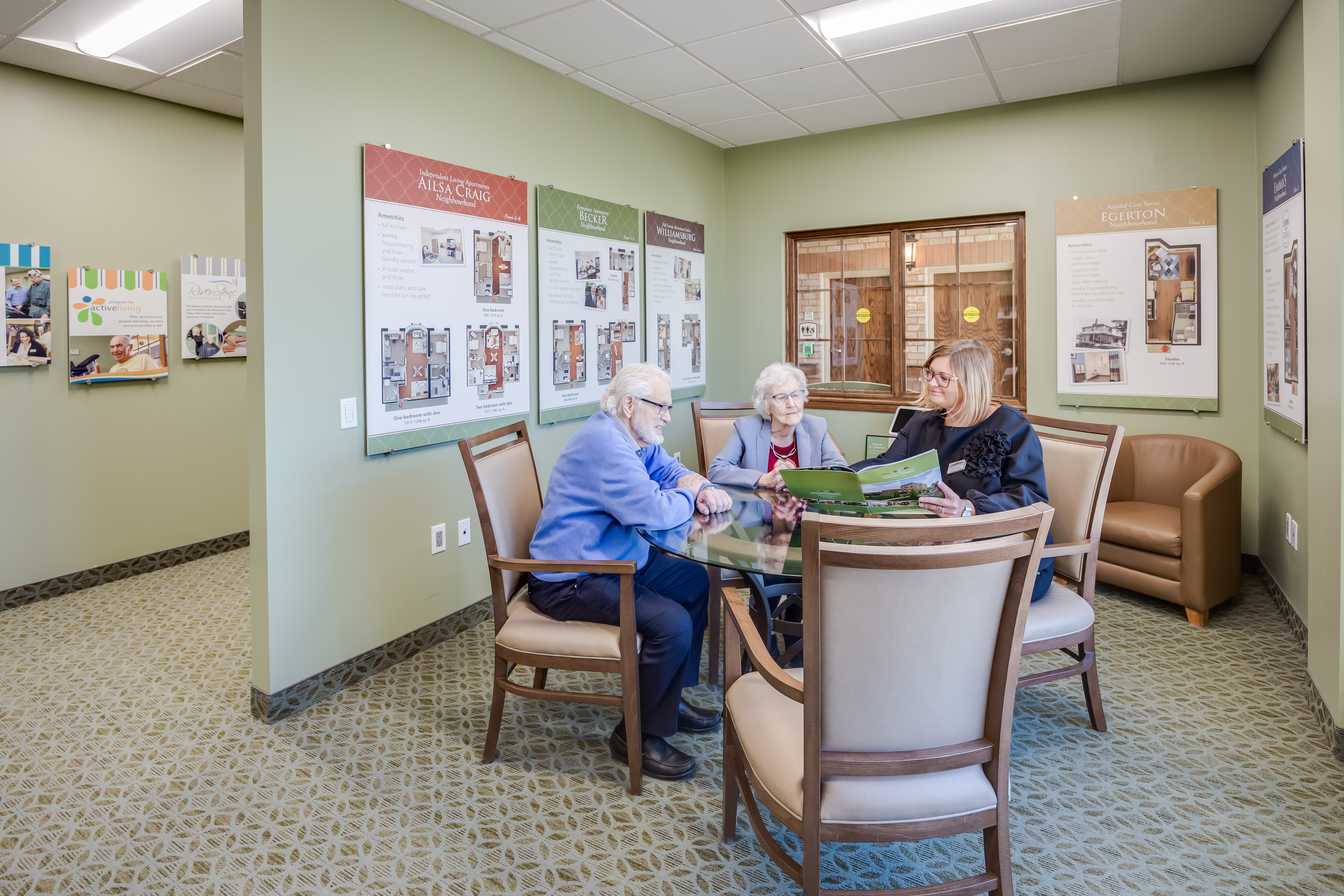Director of Lifestyle Options meets with future resident in the Welcome Centre at The Village of Glendale Crossing