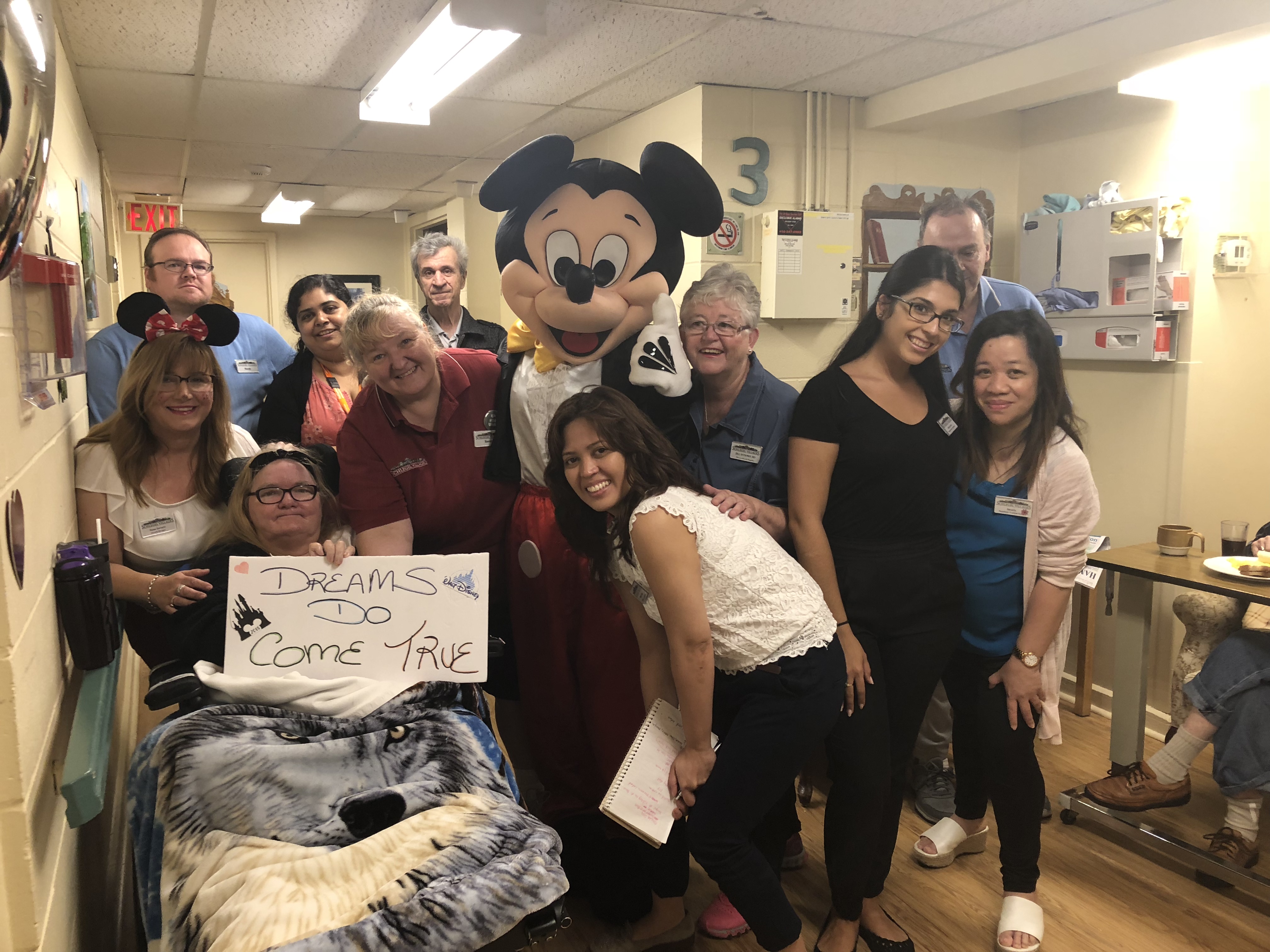 Hamilton Continuing Care team with Mickey Mouse