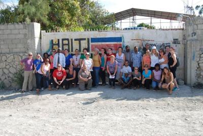 Group of Schlegel Ambassadors standing in front of the Communitere in Haiti