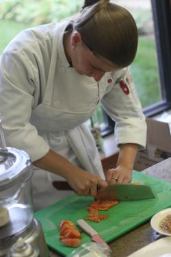 A chef chopping up vegetables