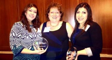 Michelle Wood, Michelle Vermeeren and Hiam Elabd from Glendale Crossing holding a glass award