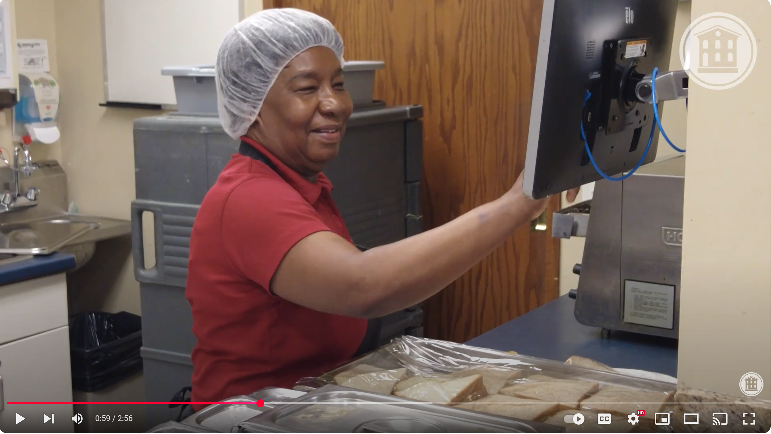 Video screengrab of team member in the kitchen