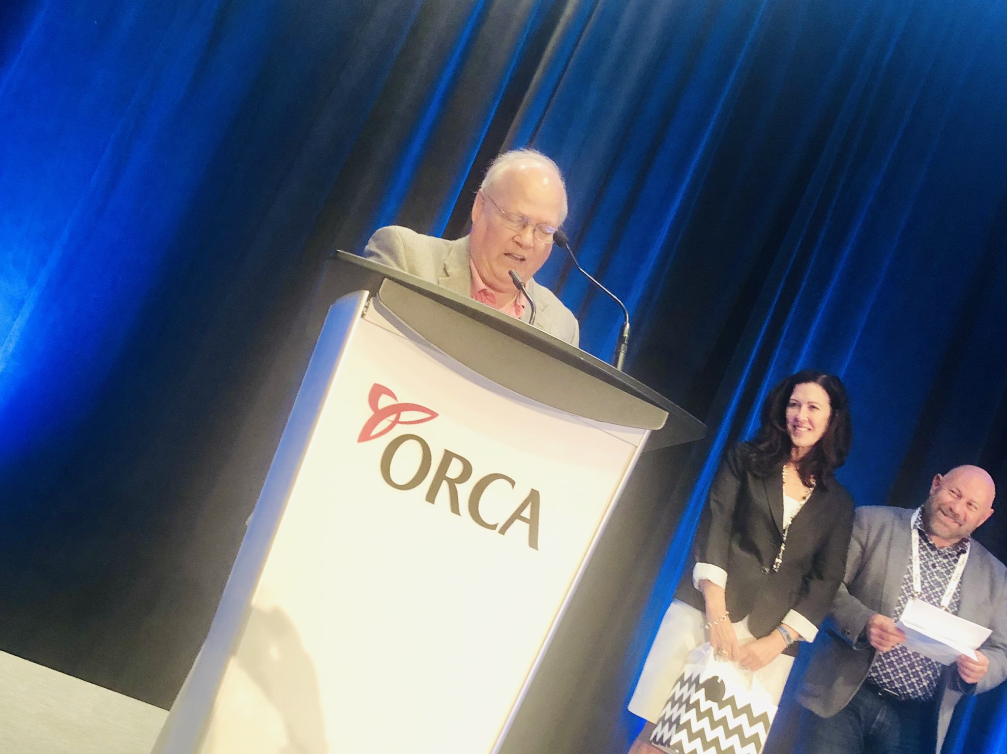 Ron Schlegel proudly accepts the Donna Holwell Legacy Award, presented by the Ontario Retirement Communities Association.