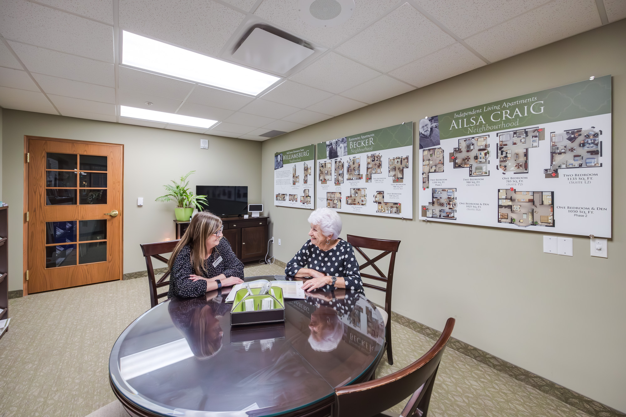Senior meets with Team Member to discuss moving into Retirement Living at Taunton Mills