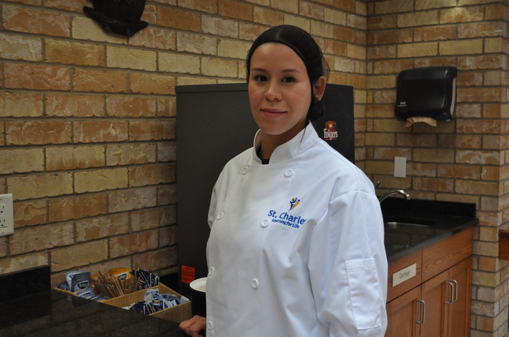 Sara poses in her culinary uniform during her placement at the Village of Wentworth Heights. 