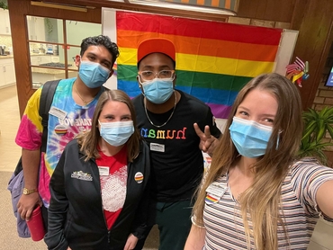 Team Members dressed in pride rainbow wear
