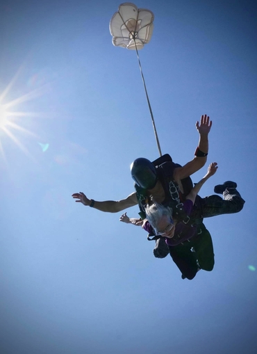 Sandra flies through the air on her 10,000-foot skydive. 
