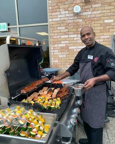 Ruby chef Nimal Piyarathna looks after the grill during the patio party.