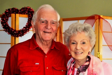 Bill and Helen stand together smiling.