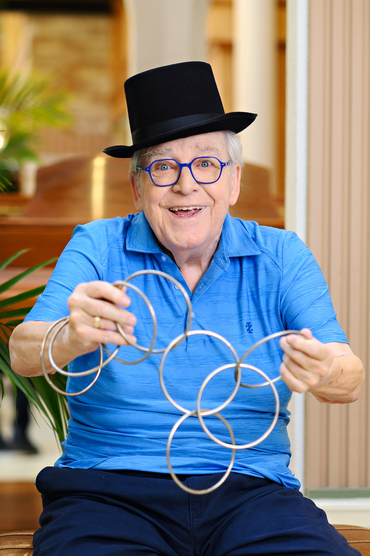 Woody Gordon Hale holding magic linking rings