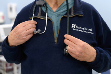 Doctor wearing a stethoscope and Sunnybrook hospital sweater