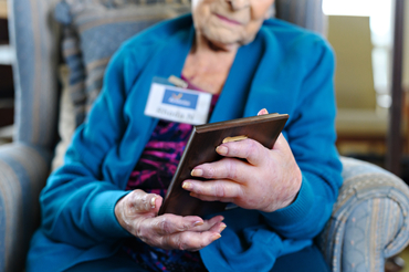 Rhoda holding an award for her volunteer work