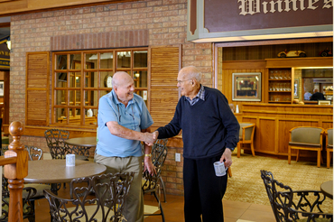 Ron Schlegel shaking hands with residents at Winston Park
