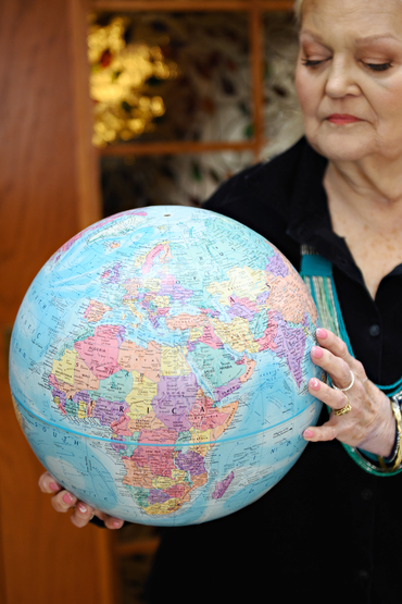Jane Bagnall portrait holding a globe
