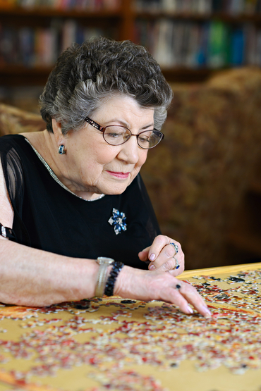 Marie working on a puzzle