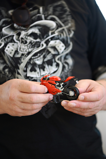 Ben holding a toy motorcycle