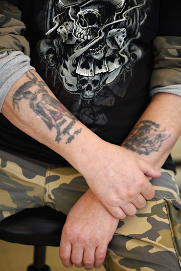 Ben showing his tattoos
