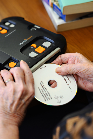 Marcy using an audio book machine