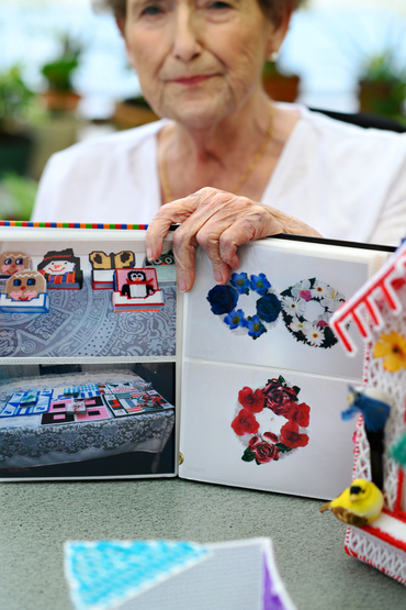 Carole showing her book with photos of her crafts