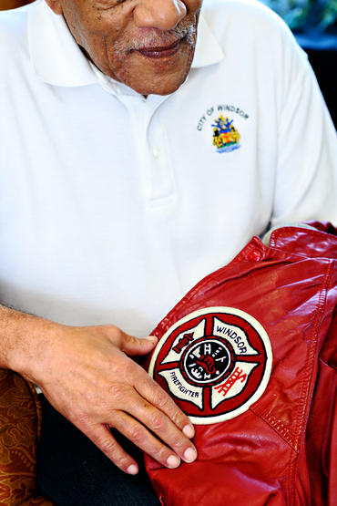 Ron Jones shows his Windsor Fire jacket while wearing a City of Windsor shirt