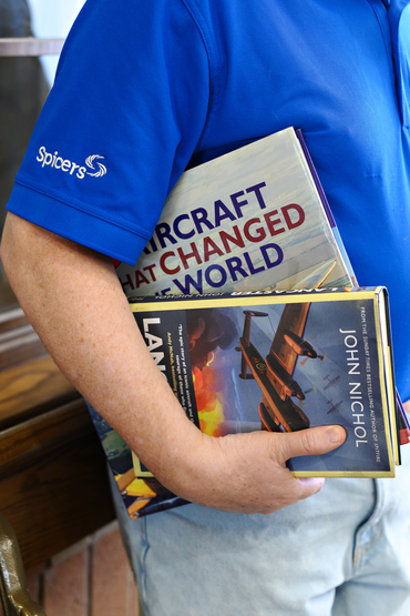 Dave Brown with aviation books under his arm