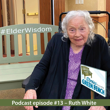 Ruth sits alongside the #ElderWisdom green bench for the podcast