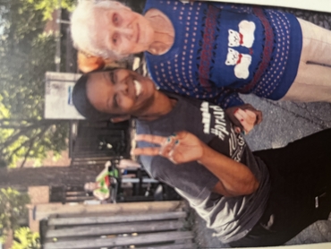 Zee smiles for the camera as she poses with a resident of Hamilton Continuing Care.