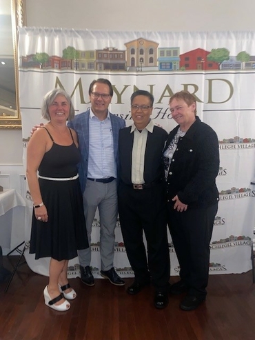 Lou stands alongside Maynard's General Manager, Julie Music, Schlegel Villages CEO Jamie Schlegel and the VP of Operations, Rose Lamb.