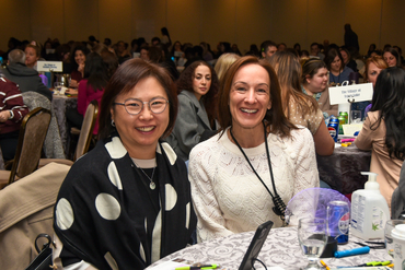 Leaders smile for the camera at conference