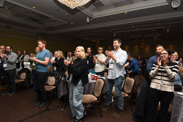 Leaders clapping in the audience