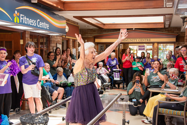 Resident competes in the Parallel Bars at the Schlegel Olympics