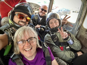 Sandra smiles for the camera while in the plane that would take her up for her skydiving adventure.