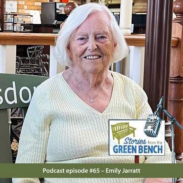 Emily Jarratt sitting on the #ElderWisdom bench featuring her Stories from the Green Bench podcast