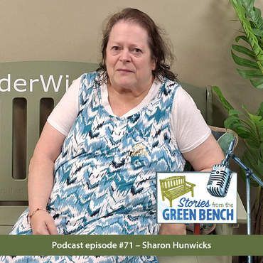 Erin Mills Lodge resident, Sharon, sitting on the #ElderWisdom green bench