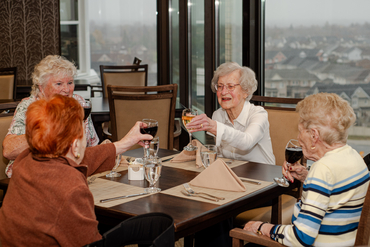 Ladies enjoying a glass of wine at The Ruby dining on the 8th floor at The Village of Taunton Mills