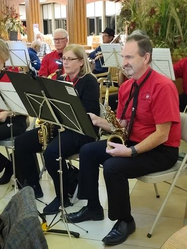 Mike Schmidt and band members playing at The Village of Winston Park