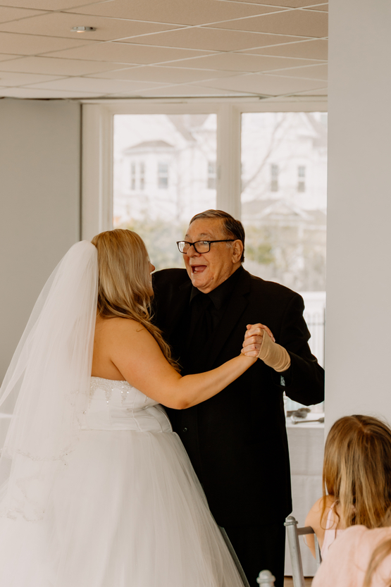 Louis is all smiles as he dances with his daughter. 