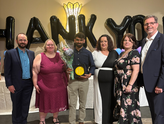 Ajay stands at the Centre of the Winston Park leadership team after receiving a 2025 Success Award.