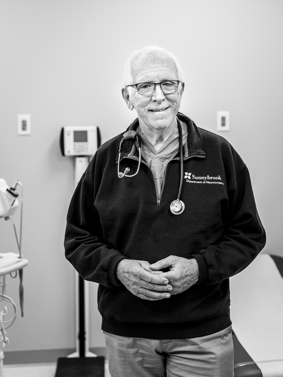 David Rowed black and white portrait in the doctors office wearing a stethoscope
