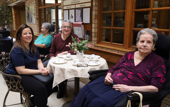 Families and residents enjoy the high tea atmosphere along Main Street at Erin Meadows. 