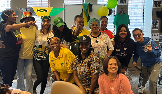 Team members representing several countries pose for a photo during Erin Mills Lodge's multicultural day celebrations.
