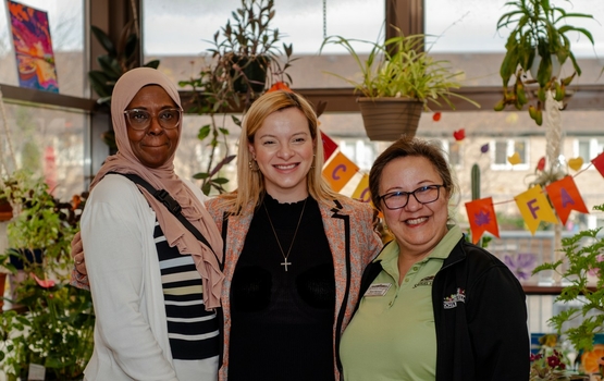 Chi and Sami pose with Ontario's Minister of Long-Term Care, Natalia Kusendova-Bashta.