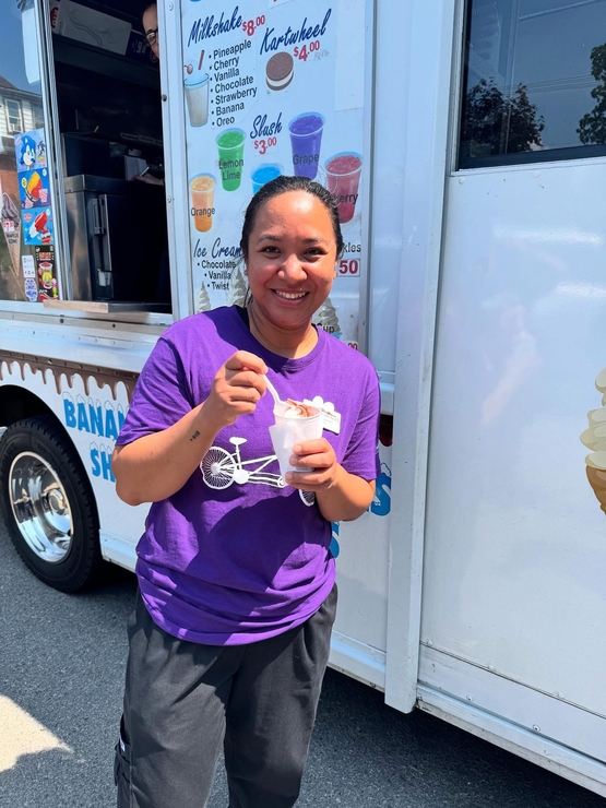 Natasha is pictured outside of a food truck during a team appreciation event at Hamilton Continuing Care. 