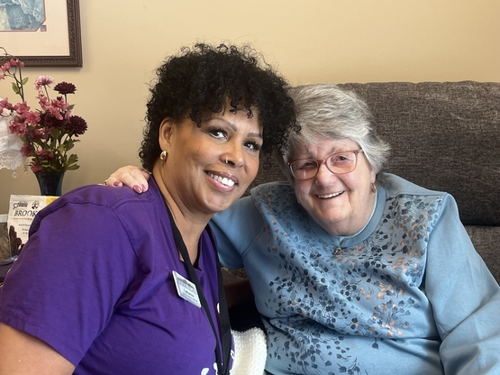Success Winner Catherine Vignon poses alongside a resident named Chris Fraser - one of many people Catherine has grown close with at Winston Park.