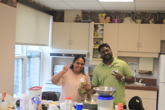 Noel and a volunteer in the country kitchen preparing for an afternoon of baking with residents. 