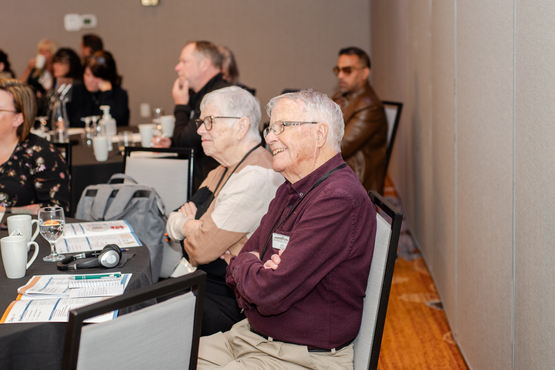 Pat and John attentively sit in on a session during the annual Innovation Summit.