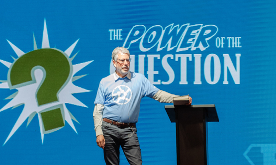 Jack York stands upon the stage during one of his sessions at Schlegel villages Operational Planning retreat. 