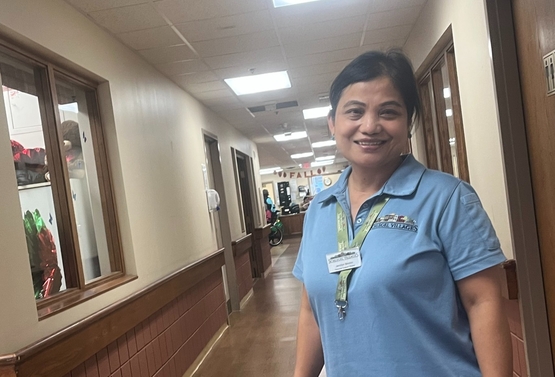 Jennilyn is pictured along the hall in her neighbourhood of the Village of Erin Meadows. She is one of the team members who has transitioned to 12-hour shifts under the new Flex Scheduling arrangement for team members. 